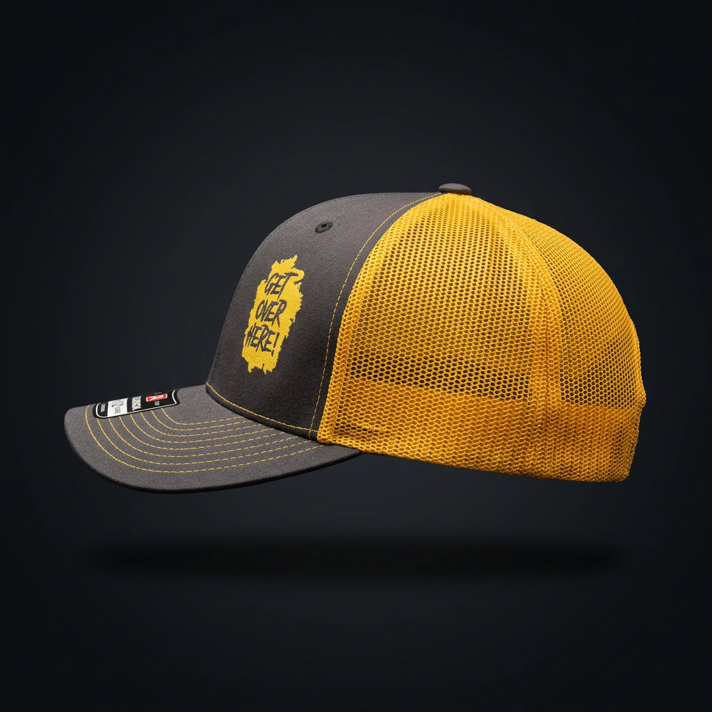"Get Over Here!" black and gold trucker hat, side profile with gold mesh back